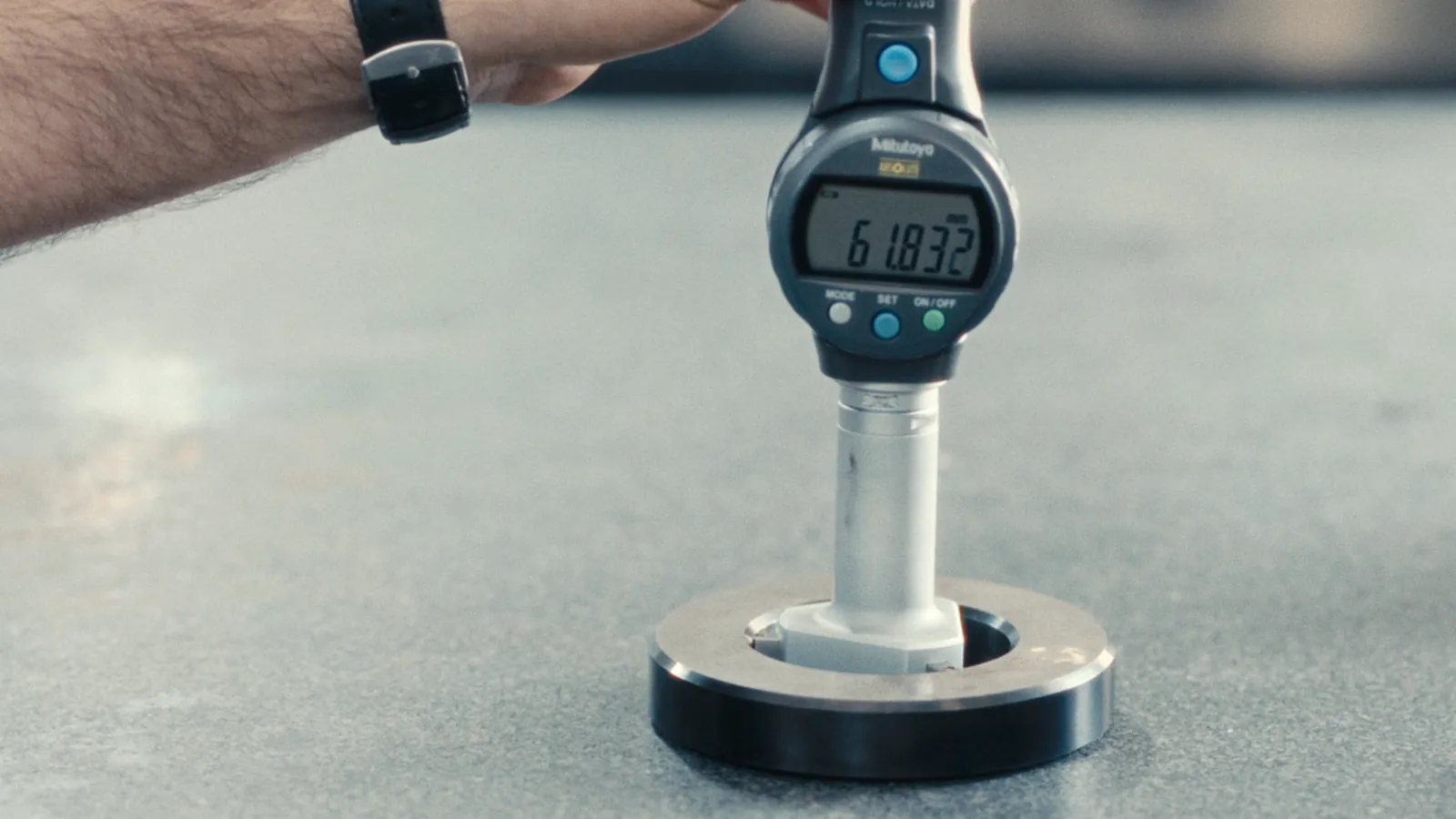 Digital depth gauge measuring a machined ring