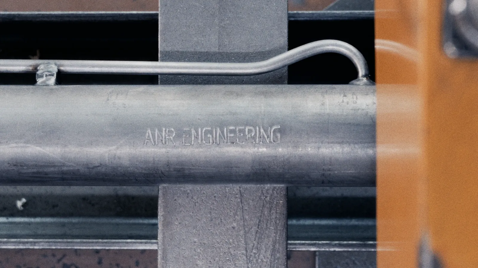 ANR Engineering branding engraved on a cylinder tube